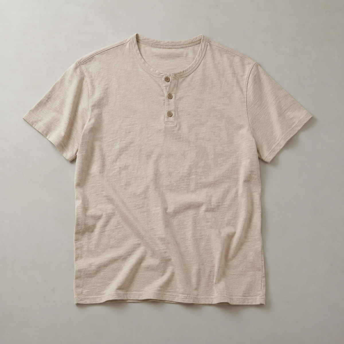 one beige men's short-sleeve henley shirt with round collarless neckline and three-button placket