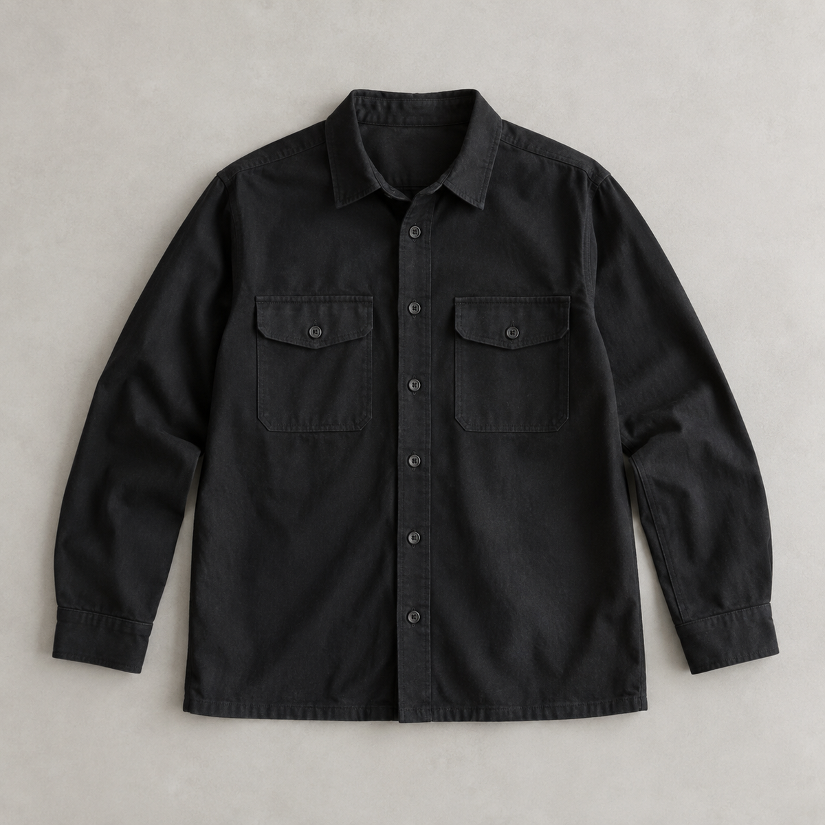 one black men's long-sleeve button-front overshirt, two symmetrical chest patch pockets with flaps, classic collar, straight hem